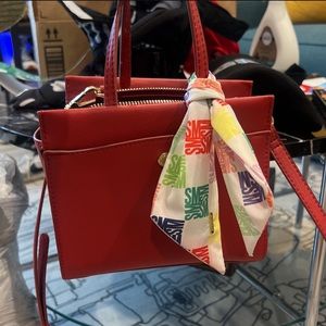 Super cute red hand bag by Steve Madden never used